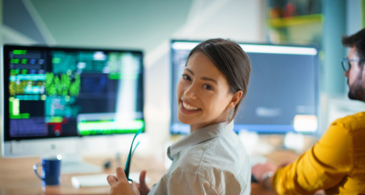 female programmer sitting at workstation