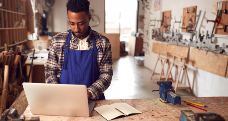 male entrepreneur running cabinet making business