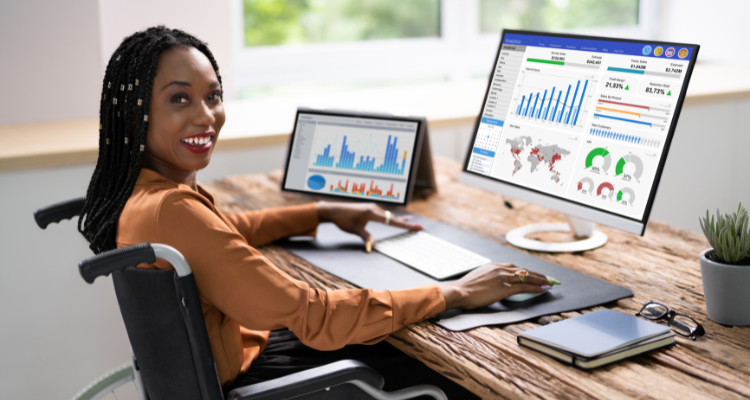 female business analysist in wheelchair showcasing data dashboards