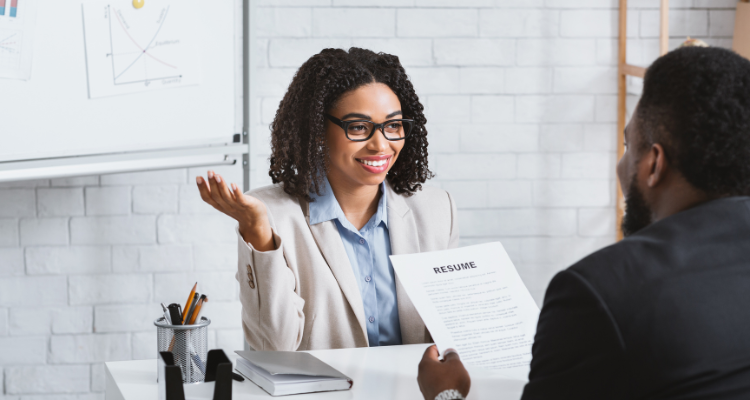 female human resource personnel interviewing job candidate