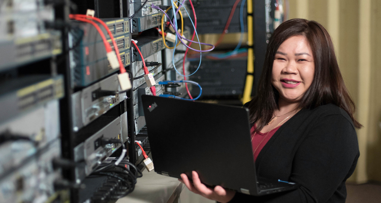 female working on connecting servers to the network